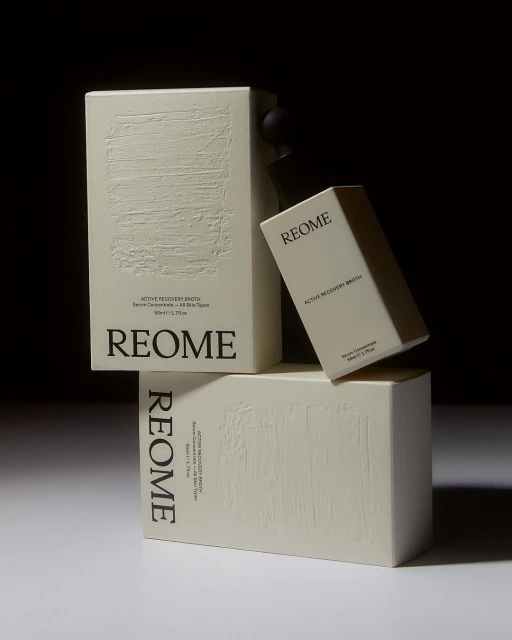Aesthetic skincare product presentation featuring REOME Active Recovery Drops and Serum Concentrate in a minimalist composition with soft lighting.