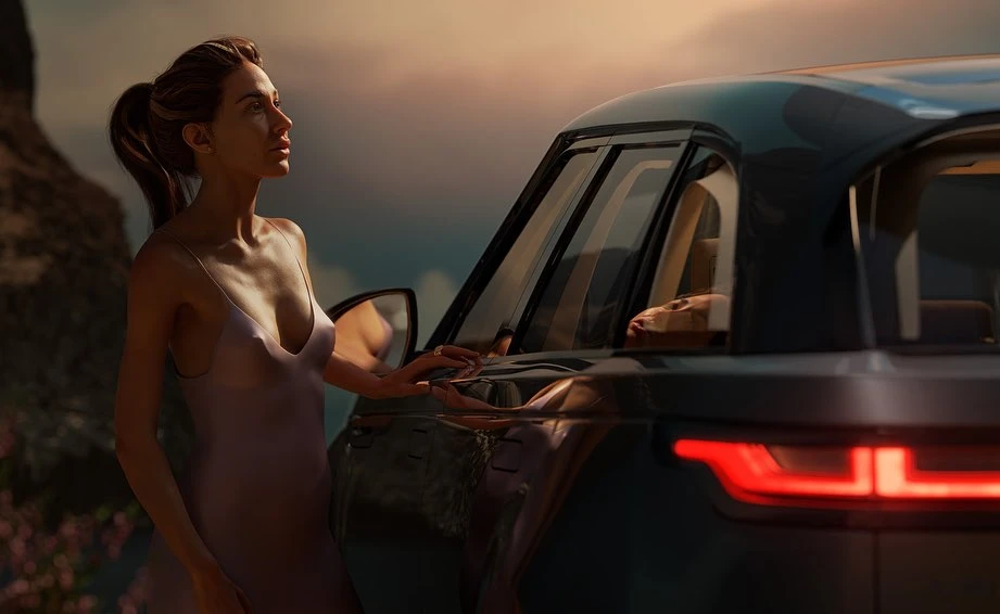 An adult woman in a purple dress stands beside a dark grey Range Rover SUV with a twilight sky and distant mountains in the background.