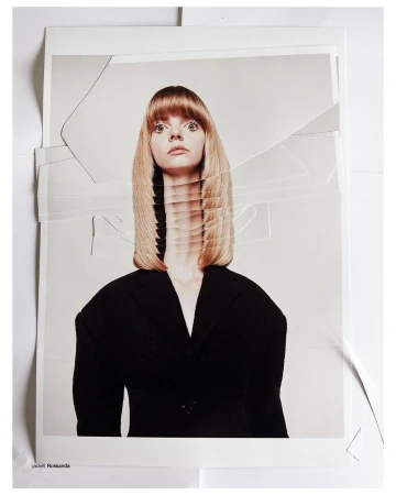 Portrait of a woman with blonde hair and a black jacket, styled with artistic layering and shot in a photo studio against a white backdrop.