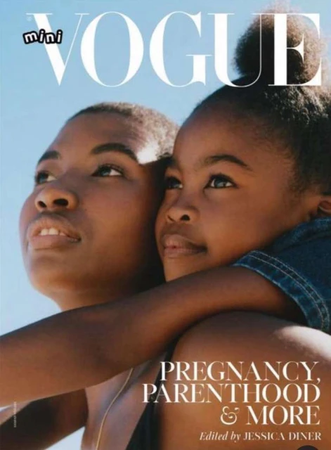Fashion magazine cover featuring an adult female and a child embracing against a clear sky backdrop, promoting content on pregnancy and parenthood.