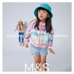 Young child in a turquoise bucket hat and tie-dye zip jacket standing against a seamless light background with text overlays.