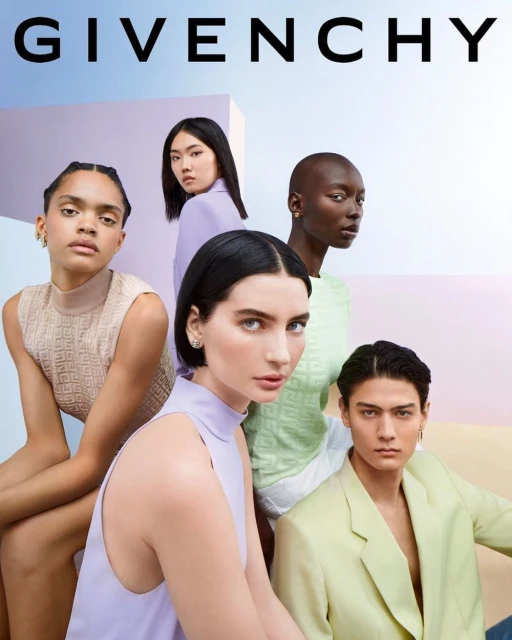 Group of five diverse models pose in Givenchy ad against a pastel geometric background, showcasing high-fashion elegance.