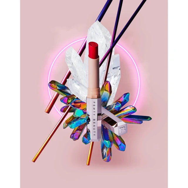 Fenty Beauty lipstick with shimmering crystal accents, bright makeup photography, and pink background for beauty and cosmetic advertising.