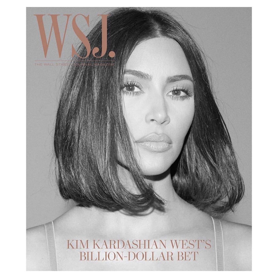 Close-up portrait of Kim Kardashian on a magazine cover in black and white, featuring a shoulder-length bob haircut and neutral makeup.