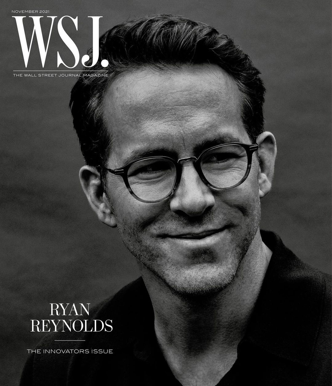 Black and white portrait of Ryan Reynolds on the cover of WSJ. Magazine, November 2021, wearing glasses and a dark shirt.