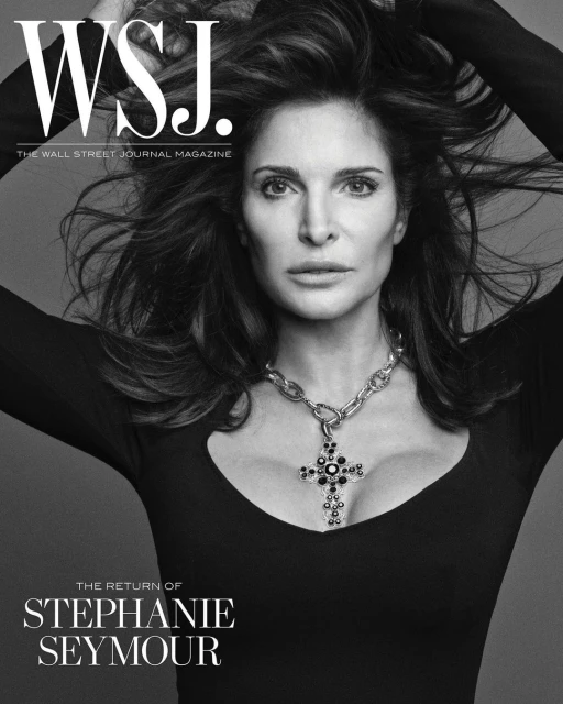 Stephanie Seymour poses in a close-up portrait for the Wall Street Journal Magazine cover wearing a cross necklace. Black and white image.