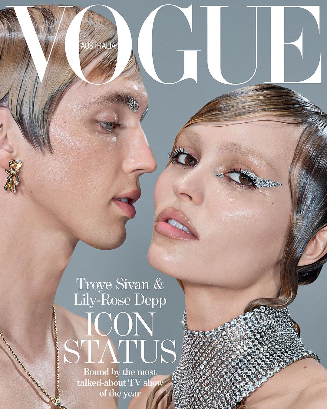 Vogue Australia magazine cover featuring Troye Sivan and Lily-Rose Depp. Close-up of the two celebrities with glamorous makeup and fashion jewelry.