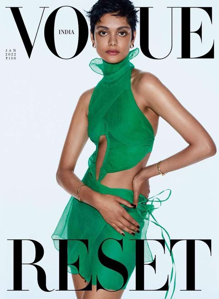 Vogue India cover featuring a model in a green halter dress, posing against a white backdrop with bold 'RESET' typography below.