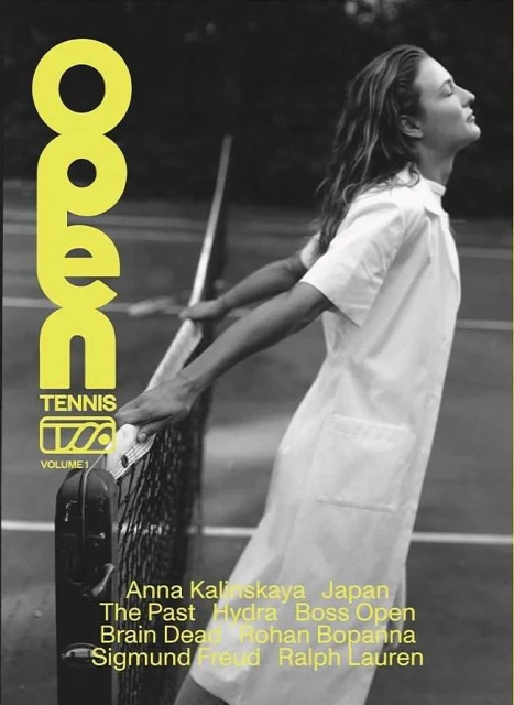 Magazine cover featuring a woman in a white dress near a tennis net, with yellow stylized text and credits against a neutral background.