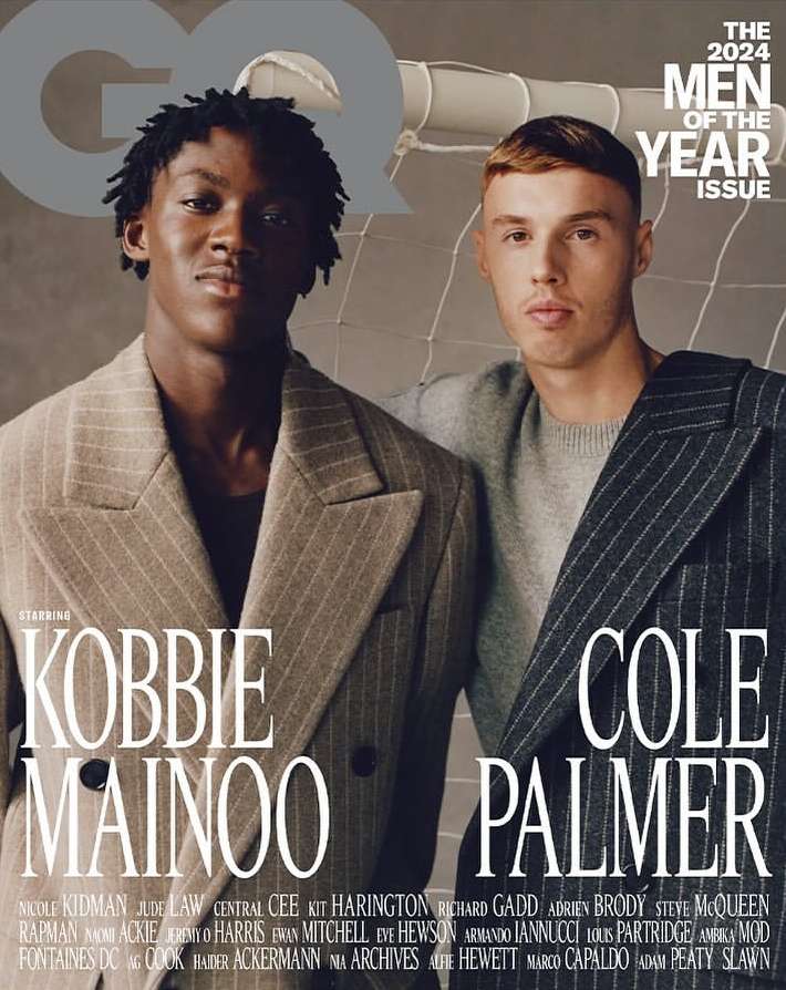 GQ magazine cover featuring Kobbie Mainoo and Cole Palmer, two young adult males in formal wear, posing in front of a white net.