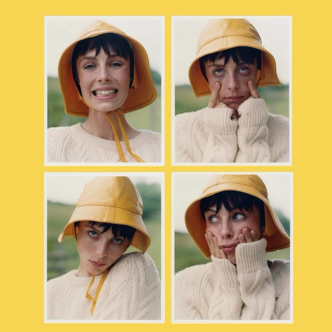Four portraits of a woman with short dark hair wearing a yellow rain hat and a cream-colored sweater with a grass and sky background.
