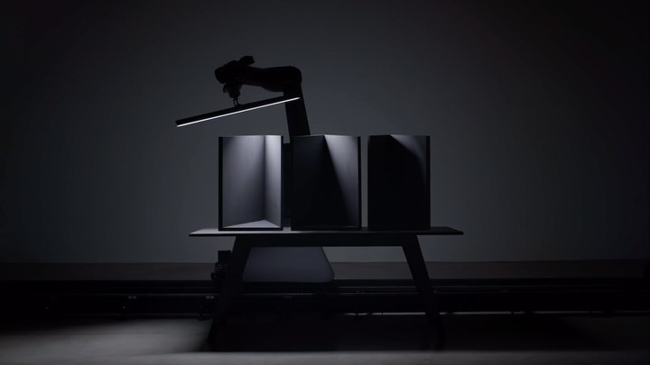 Stylized product photography showcasing three containers on a table, highlighted by dramatic lighting in a dark photo studio.