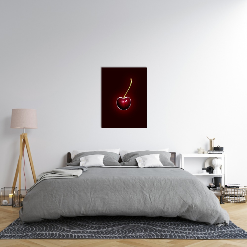 Bedroom features a gray upholstered bed, a nightstand with a lamp, and a framed photograph of a cherry on the wall.