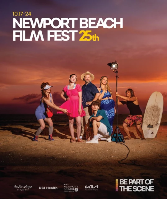Group of people on a beach at sunset for the Newport Beach Film Fest 25th, including a film light, surfboard, and film festival text.