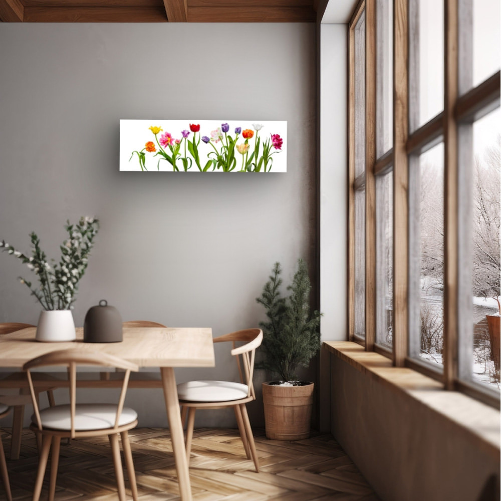 Bright floral art on a grey wall in an airy dining room with a wooden table, chairs, and view of a snowy winter landscape.
