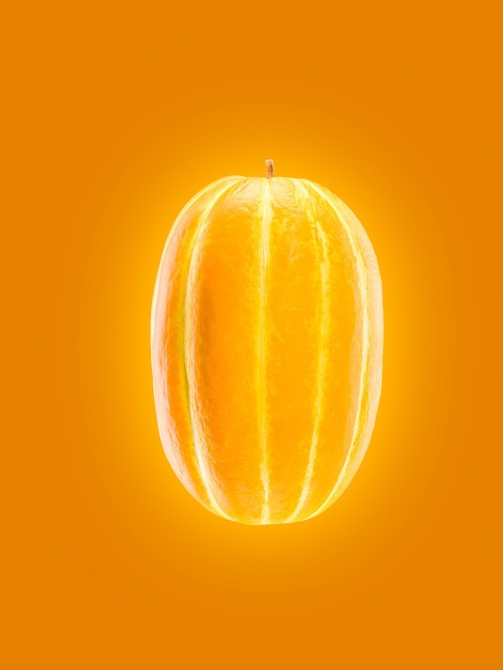 An oval-shaped golden melon is centered on a gradient orange background, highlighting its smooth skin and subtle white stripes.