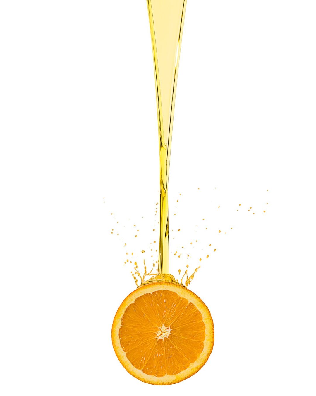 Pouring liquid on a halved orange, creating a splash against a white background, showcasing food photography and studio setting.
