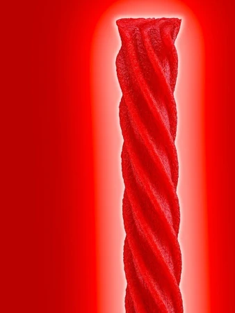 Close-up studio shot of a single red licorice twist against a bright red background with central lighting.