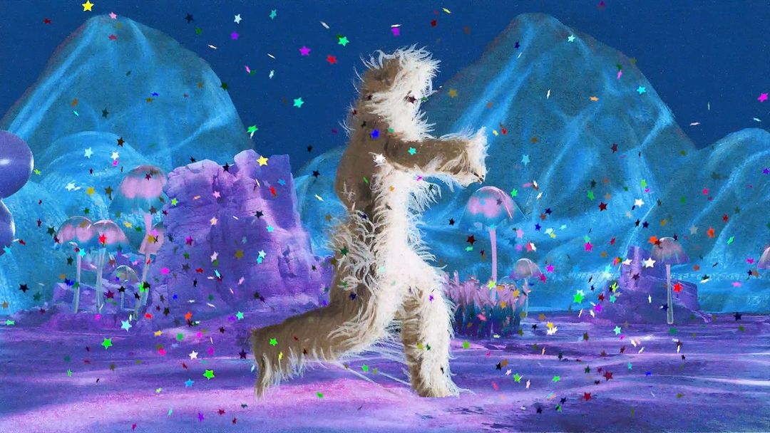 Fur-covered figure runs on a purple surface with confetti under a blue sky with mountain-like forms and mushroom-shaped objects.
