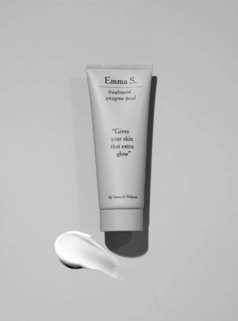Emma S. Treatment Enzyme Peel tube and a swirl of the product on a neutral background. Beauty product shot for skincare and treatment.