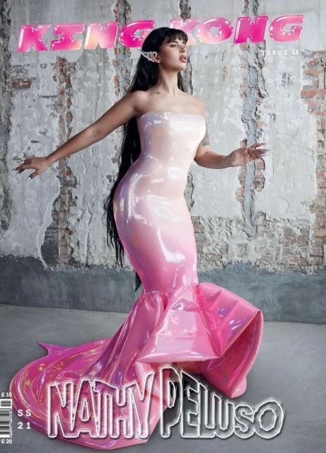 Magazine cover featuring Nathy Peluso in a pink dress with a fishtail hemline posing against a textured wall with 'KING KONG' at the top.