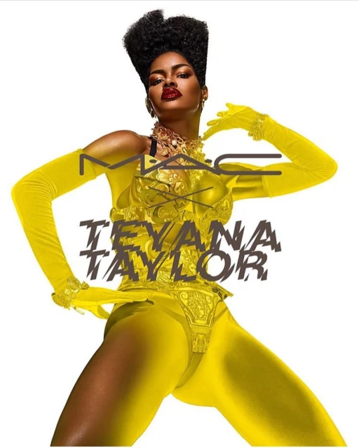 Model Teyana Taylor poses in yellow outfit with M.A.C. branding. Dark hair and red lips stand out against a plain white background.