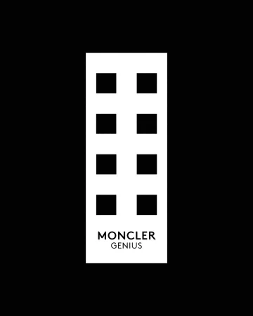 Moncler Genius logo on a rectangular shape with eight squares above the text against a dark black background in a high-contrast image.