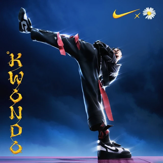 Performer in black athletic suit strikes a taekwondo pose, highlighted by dramatic lighting on a dark gradient background with logos.