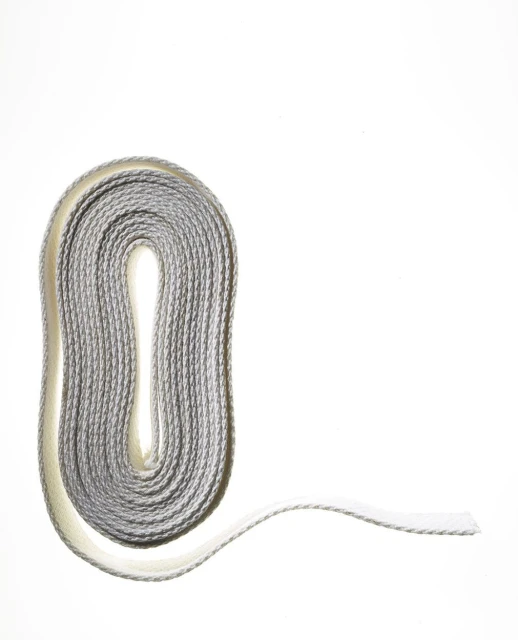 Coiled grey and white shoelace on a white backdrop, showcasing its texture and form with minimalistic and clean composition.