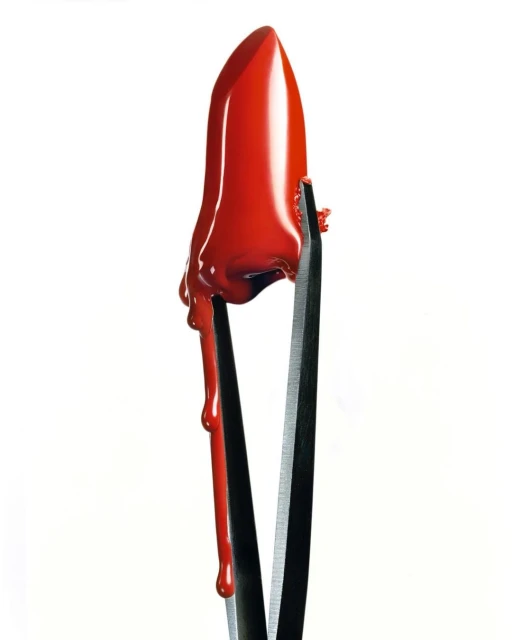 Close-up studio shot of bright red lipstick dripping and held by metal tweezers against a clean white background, dramatic beauty.
