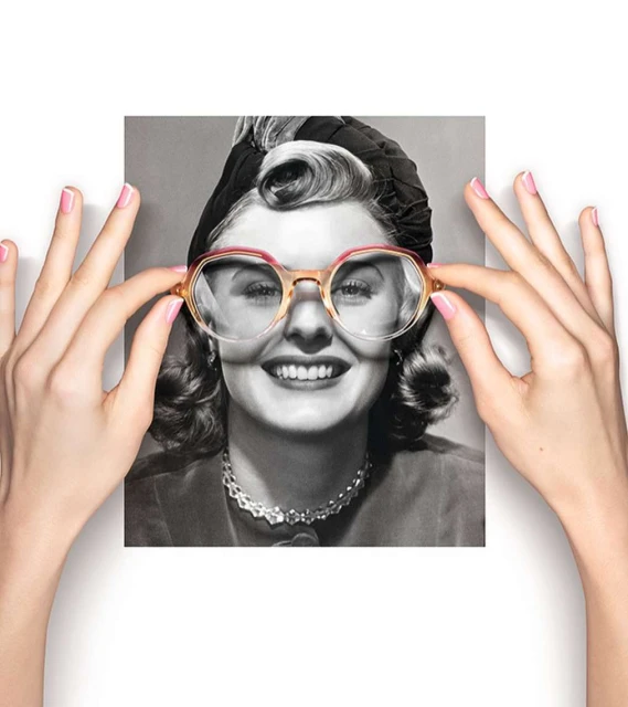 Woman in vintage photo held by hands wearing modern eyeglasses. Retro portrait combined with fashion eyewear on white.