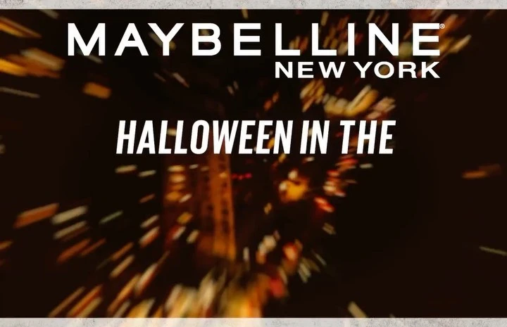Maybelline New York Halloween ad featuring blurred lights and the brand name, suitable for beauty and seasonal campaign promotions.