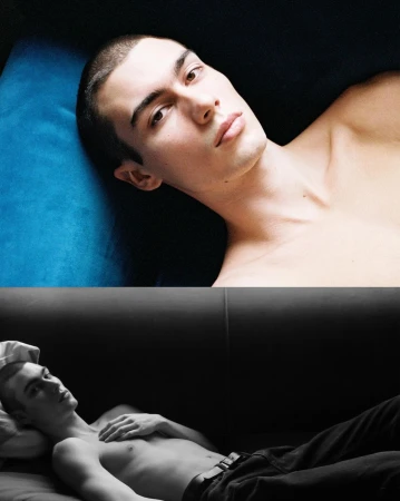 Portrait of a shirtless young man lying down against a dark background captured by Daniyel Lowden.