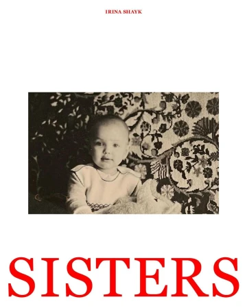 Vintage photo of a baby with a slight smile, sitting in front of a patterned textile, evokes a sense of nostalgia and warmth.