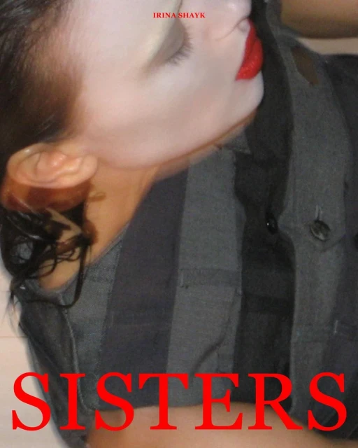 Close-up of a woman's face with red lipstick, wearing a striped button-down shirt. Partial face shot, upper body turned to the side.