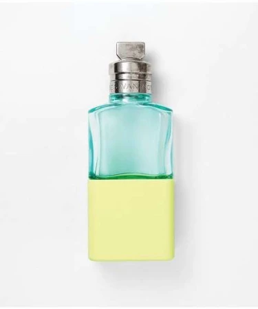 Turquoise and yellow perfume bottle on a white background. Square glass flacon with silver top. Minimalist, modern, and clean design.