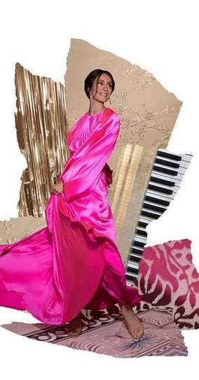 Woman in a pink satin dress strikes a dynamic pose against a collage background with textures and piano keys, creating an artful fashion image.