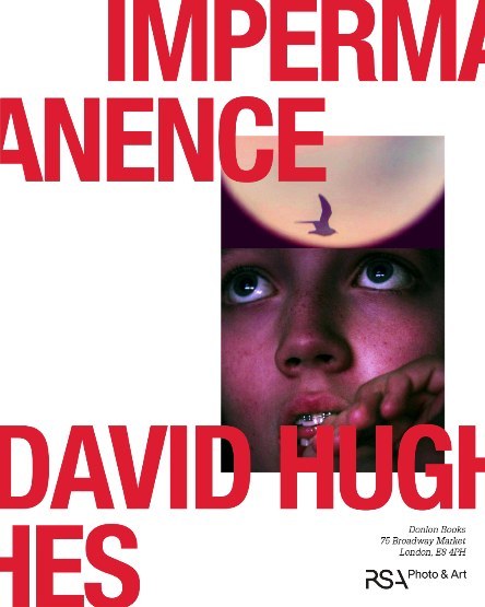 Artistic book cover featuring a child's face gazing upwards, a silhouetted bird in the sky, and bold red typography against a white backdrop.