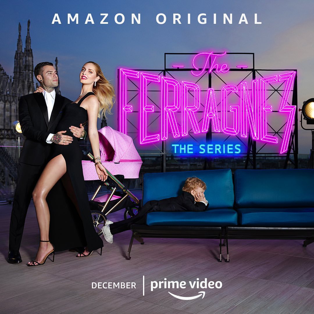 Promotional image for The Ferragnez: The Series showing a stylish couple and child on a rooftop with a Milan cathedral backdrop.