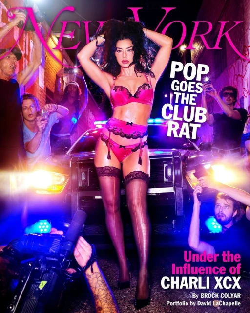 Magazine cover featuring a woman in lingerie with people and camera equipment in the background, promoting Charli XCX.