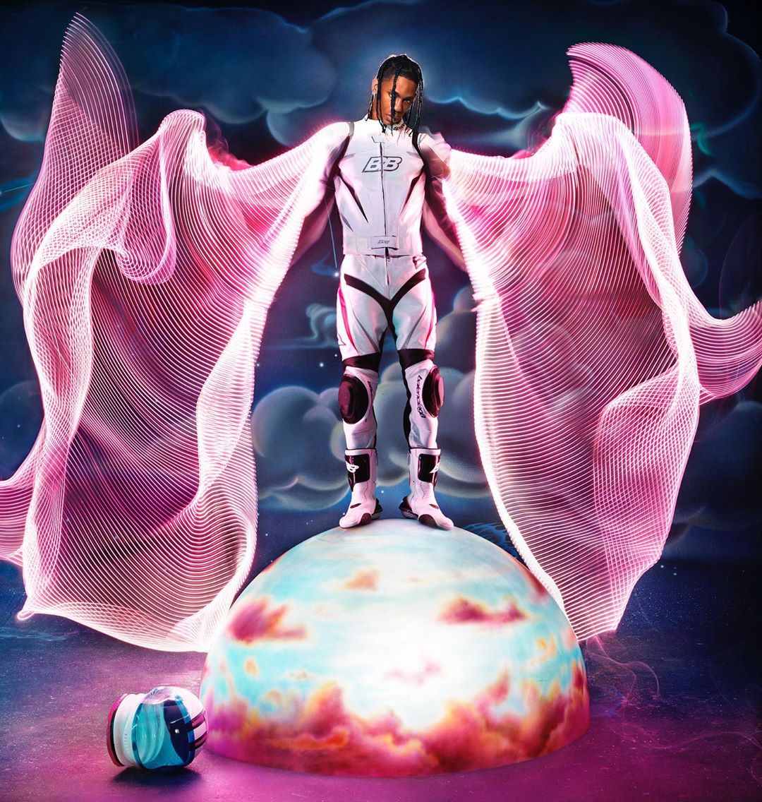 Man in white racing suit stands on a planet with pink digital light wings, creating a futuristic and artistic composition.