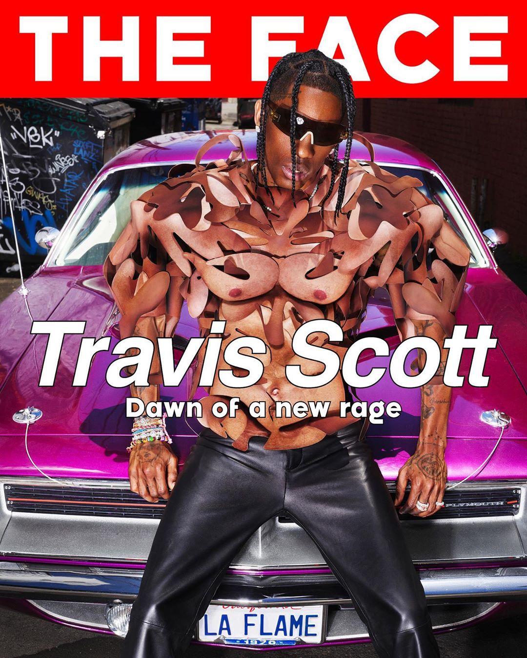 Travis Scott is featured in a digitally enhanced magazine cover standing in front of a vintage car with 'The Face' header.