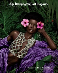 Black woman wearing a jewelled lattice top and purple fabric amidst lush tropical foliage with pink flowers