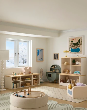 Cozy and bright kids' playroom interior featuring wooden toys, shelving units, play kitchen, round ottoman, and ample natural light.
