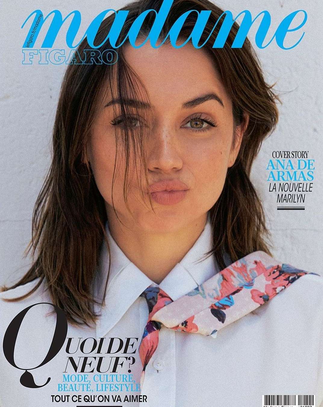 Magazine cover featuring Ana de Armas, styled hair, white collared shirt, floral neck scarf, and magazine masthead and cover text.
