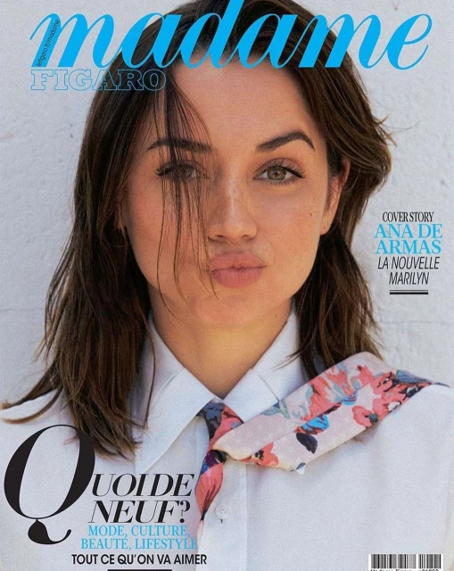 Magazine cover featuring Ana de Armas, styled hair, white collared shirt, floral neck scarf, and magazine masthead and cover text.