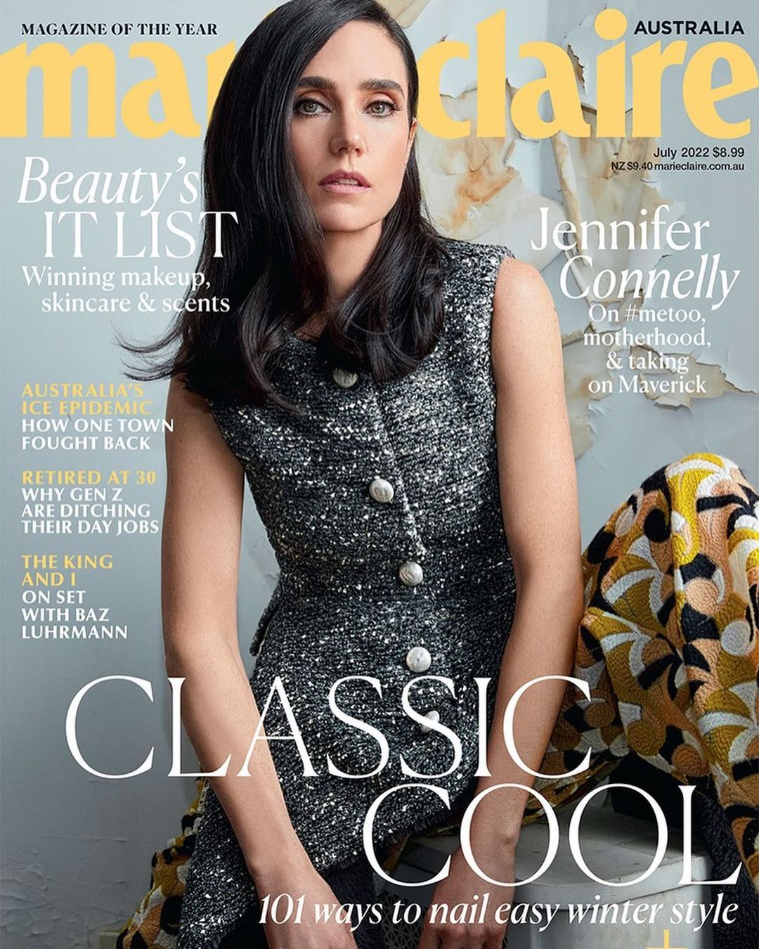 Magazine cover featuring Jennifer Connelly wearing a gray tweed dress, in front of a wall with abstract art and cover text.