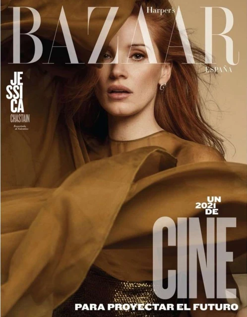 Magazine cover featuring Jessica Chastain with flowing tan fabric overlay and Harper's Bazaar logo in the upper portion of the frame.