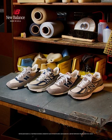New Balance footwear displayed on a workbench with vintage tools and materials. Four pairs of sneakers are shown close up.