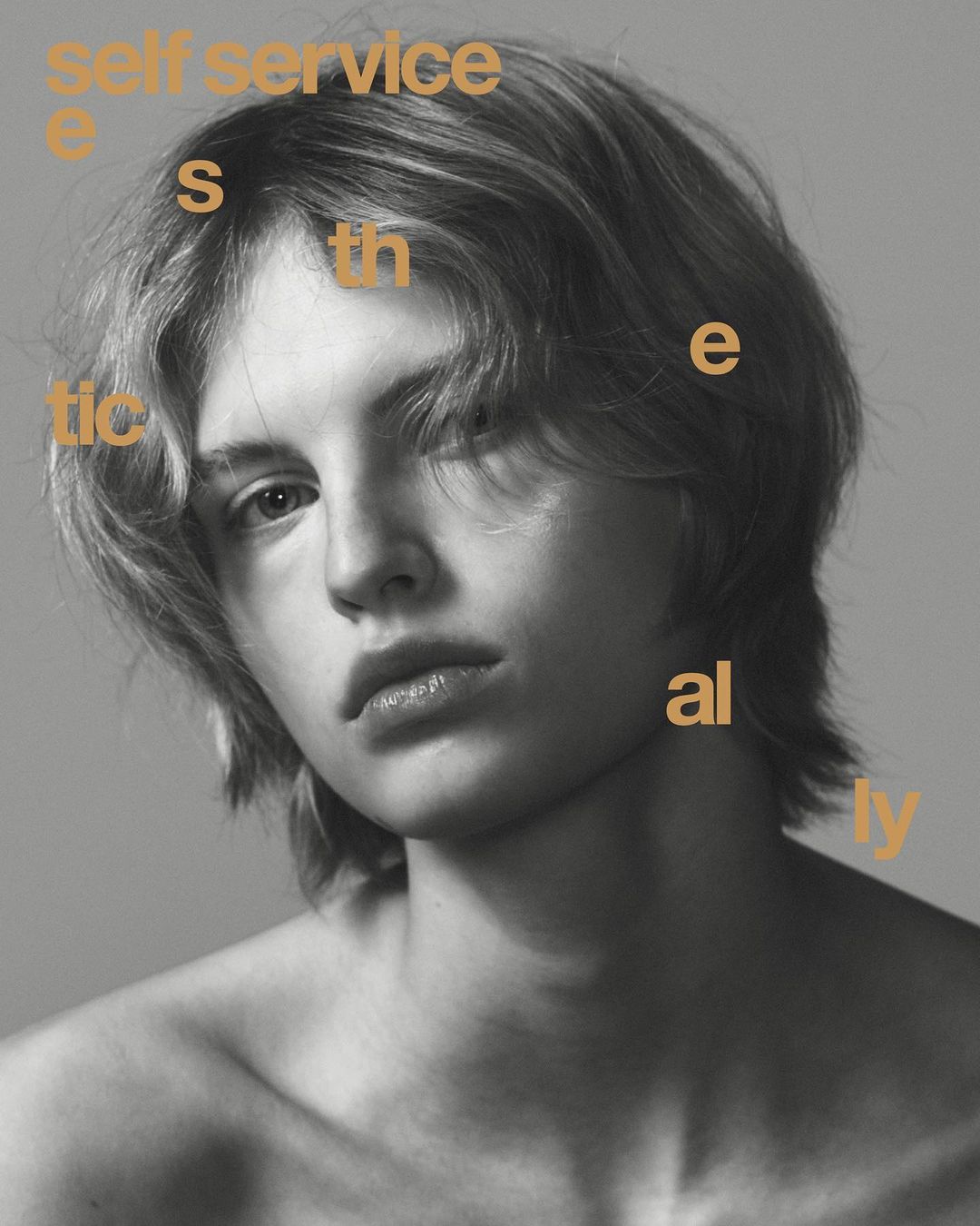 Monochrome portrait of a young adult with medium-length blonde hair, bare shoulders, and tan-colored typography overlaid.